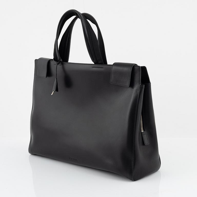 Prada, a black leather bag.