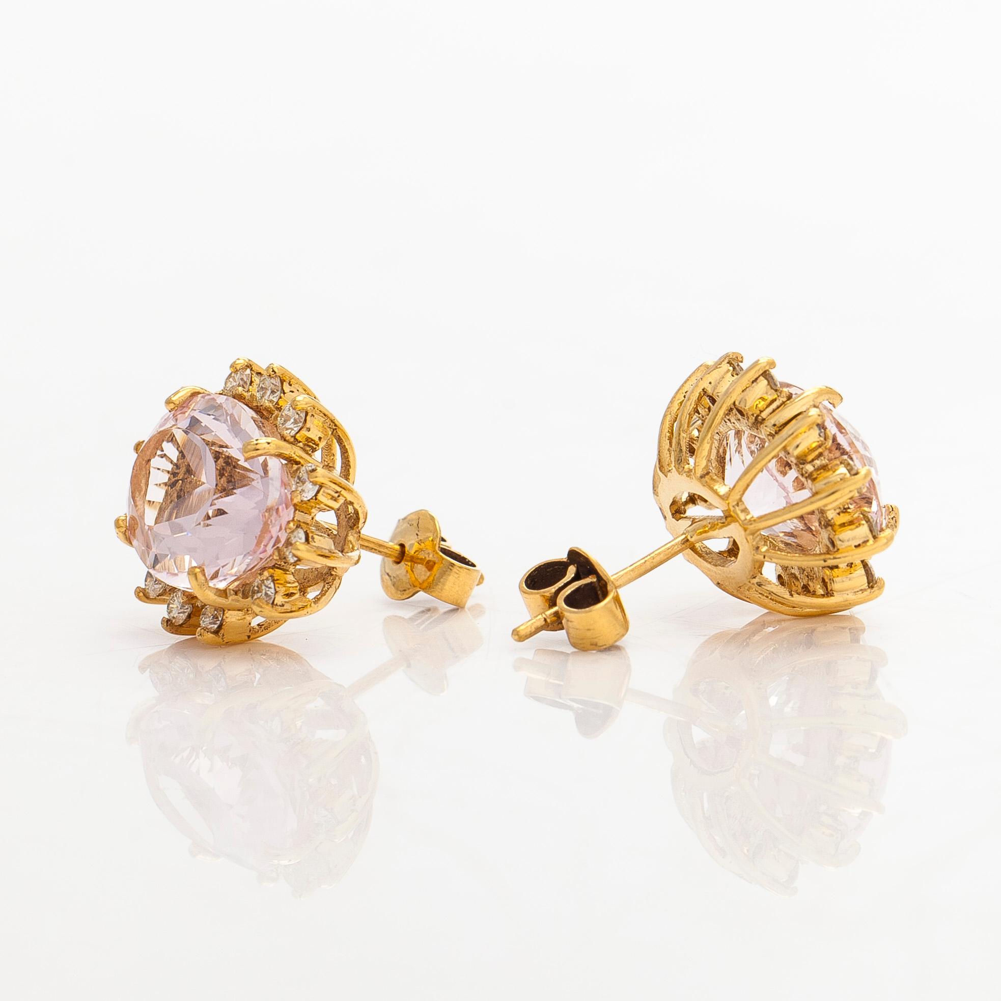 A pair of 14K gold earrings with faceted morganites and brilliant-cut diamonds.