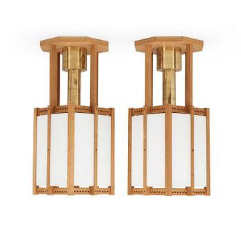 555. A pair of John Kandell oak, brass and opaque glass celing lamps, Sweden 1950's.