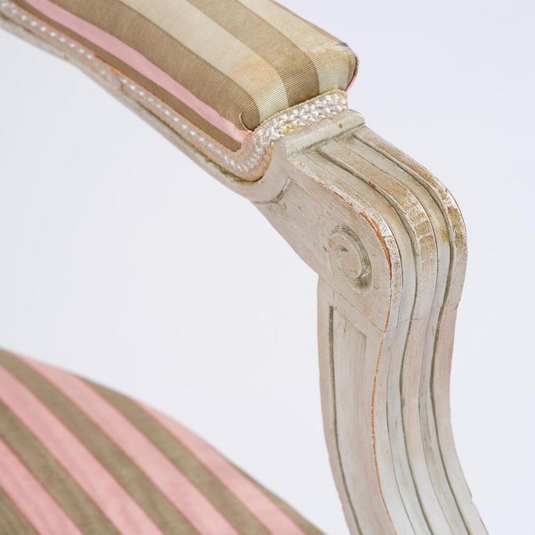 A pair of Gustavian open armchairs by E. Öhrmark (master in Stockholm 1777-1813).