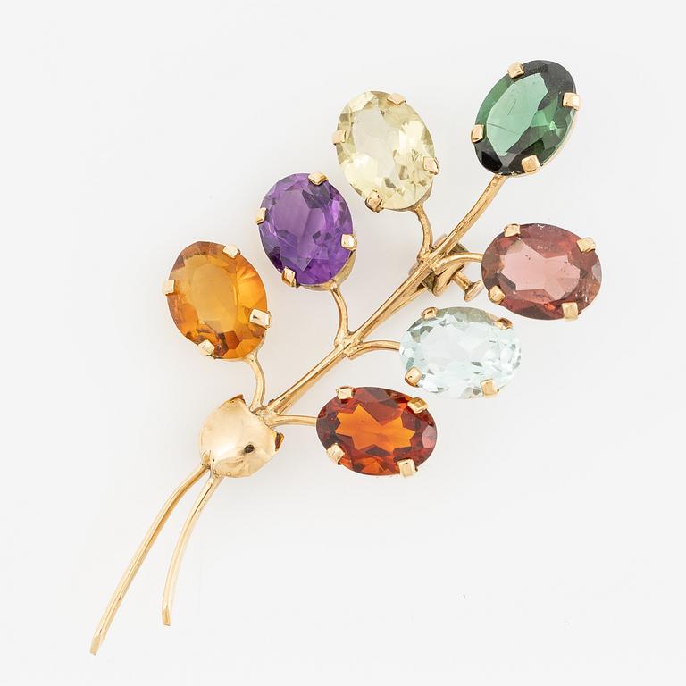 Brooch, 18K gold with citrine, amethyst, and tourmaline among others.