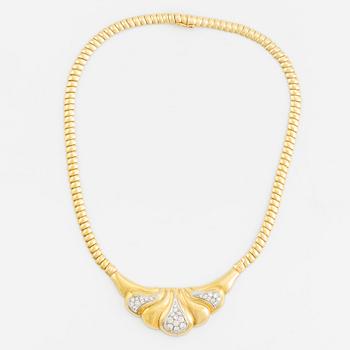 An 18K gold necklace set with round brilliant-cut diamonds.