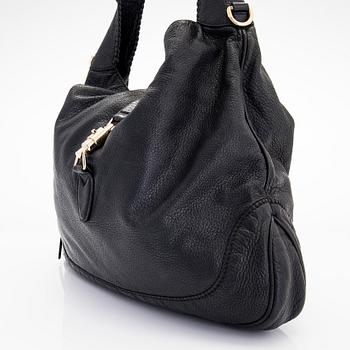 Gucci, a 'Bamboo Jackie Tassel' shoulder bag.