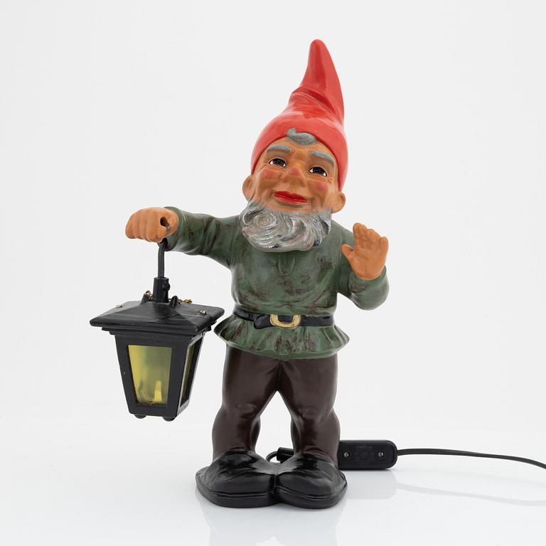 A West German earthenware gnome with lantern from the second half of the 20th century.