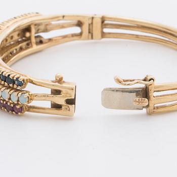 BANGLE 14K gold w rubies, sapphires and opal.