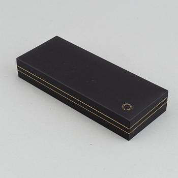 MOntblanc, a ball point pen and leather passport holder.