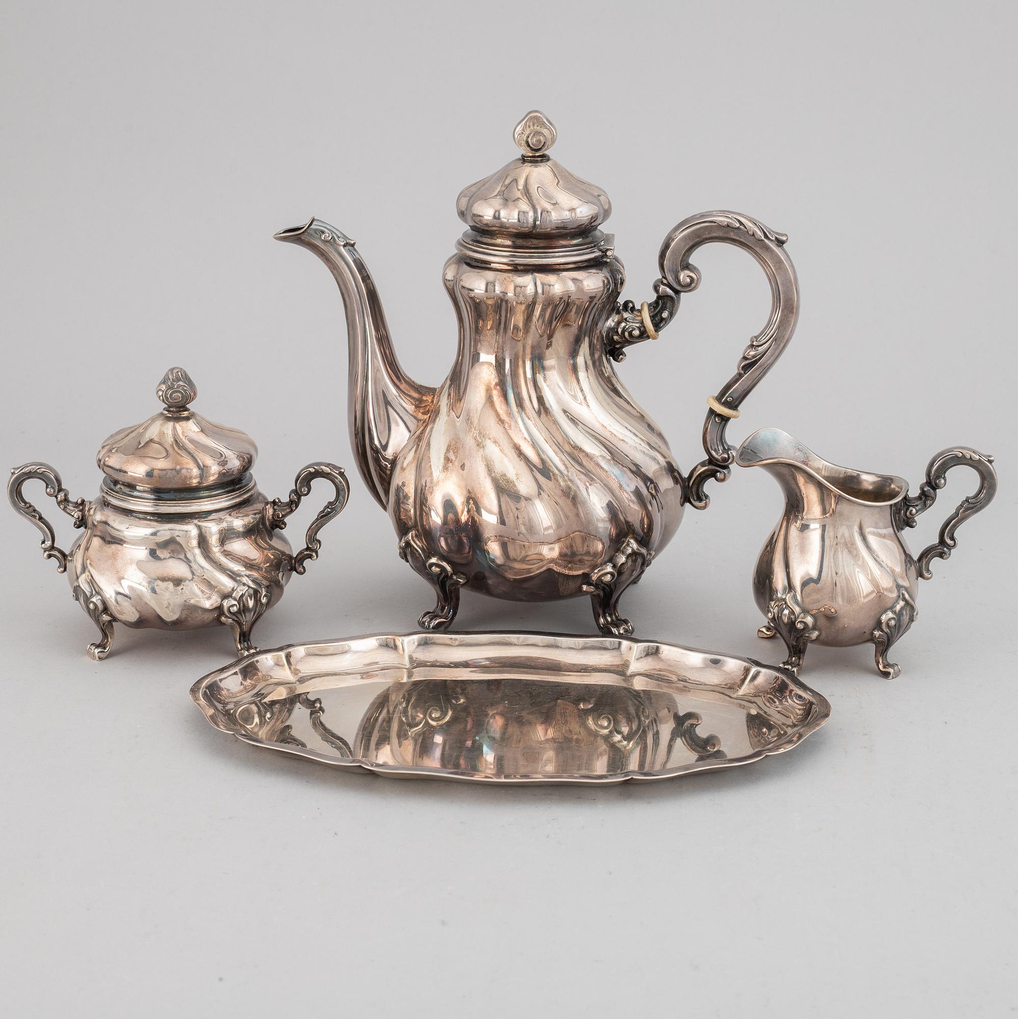 A silver coffee pot, creamer, sugar bowl and tray, swedish import mark.