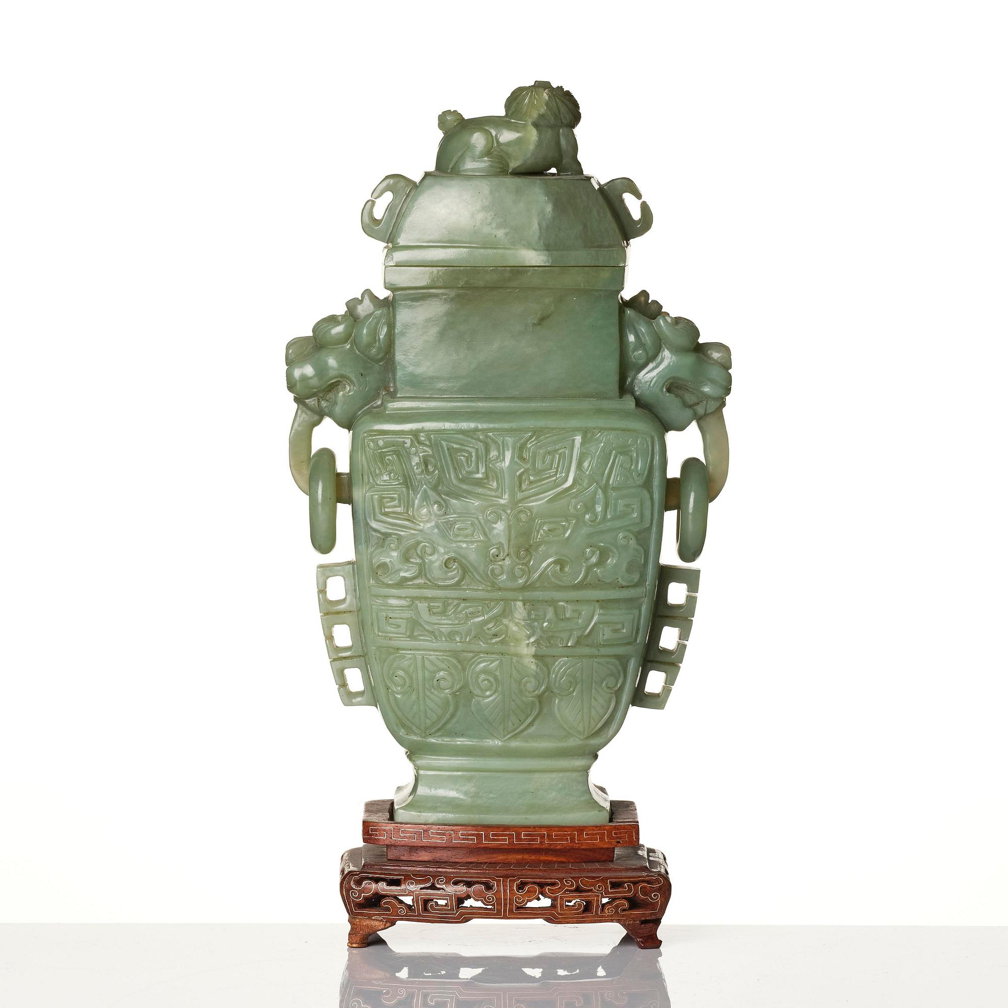 A Chinese archaistic bowenite vase with cover, Republic/20th century.