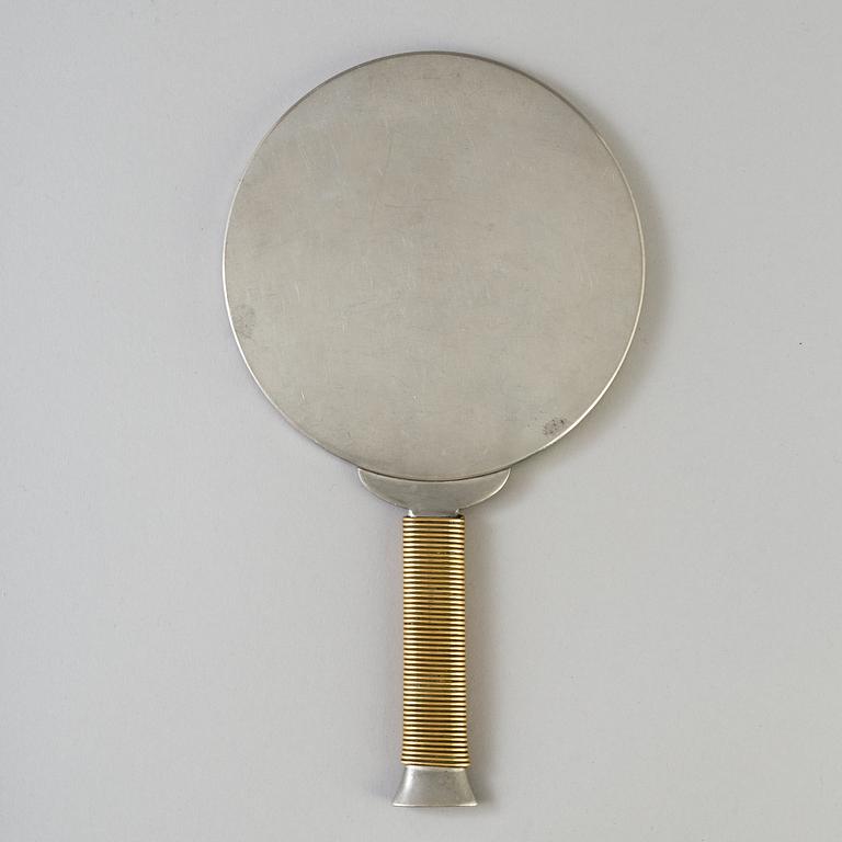 ESTRID ERICSON AND BJÖRN TRÄDGÅRDH, a pewter and brass handmirror from Firma Svenskt Tenn.