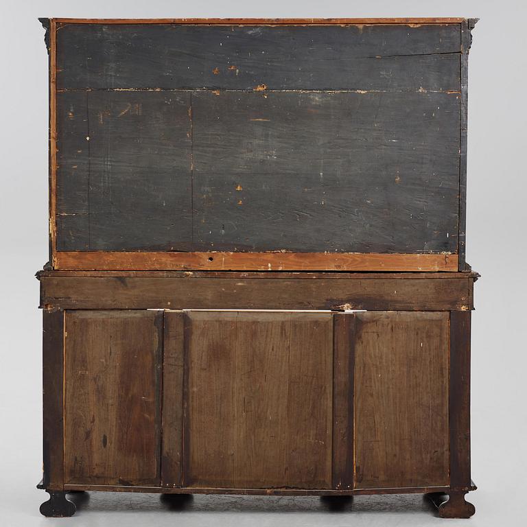 A Louis XIV and Louis XIV-style carved ebony, ivory and tortoiseshell-inlaid cabinet on stand, 17th and 19th century.