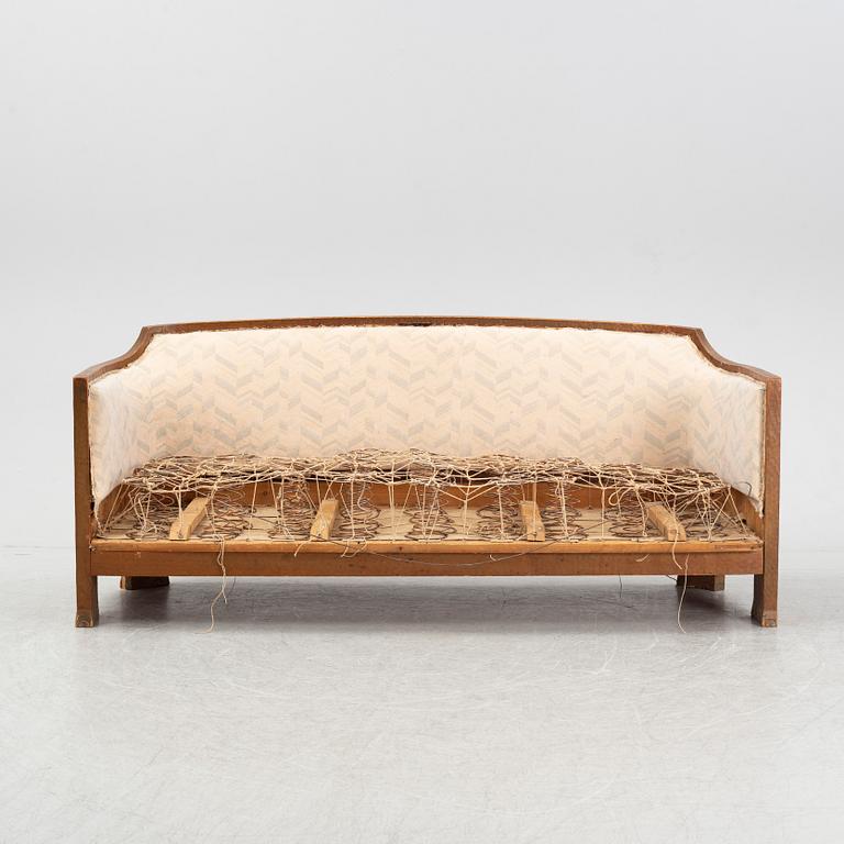 Otto Wretling, attributed to, an Art Nouveau pine sofa, Sweden early 20thC.
