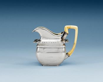 1278. A RUSSIAN PARCEL-GILT CREAM-JUG, makers mark of Wulf, St. Petersburg 1825.