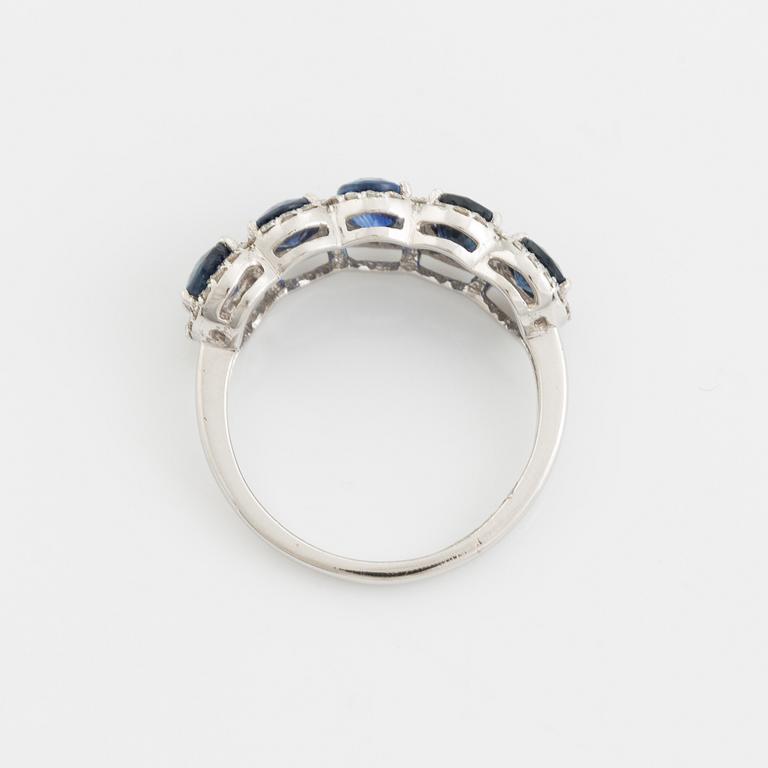 Oval sapphire and brilliant cut diamond ring.
