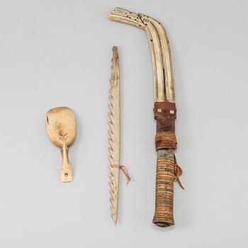 A set of 3 Sami objects, a knife by Anders Niia, 1929, a spoon and a Spear tip, beginning of  20th century.