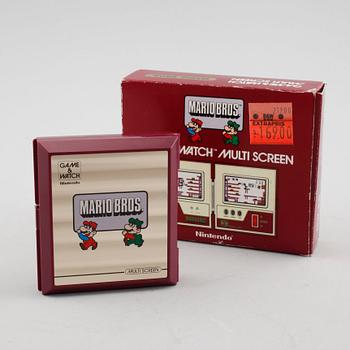 A Nintendo game & Watch, model "MW-56", multi screen, Mario Bors, 1983.