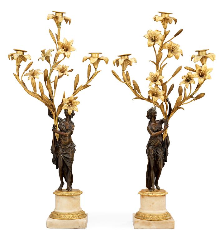 A pair of French Louis XVI-style 19th century three-light candelabra.