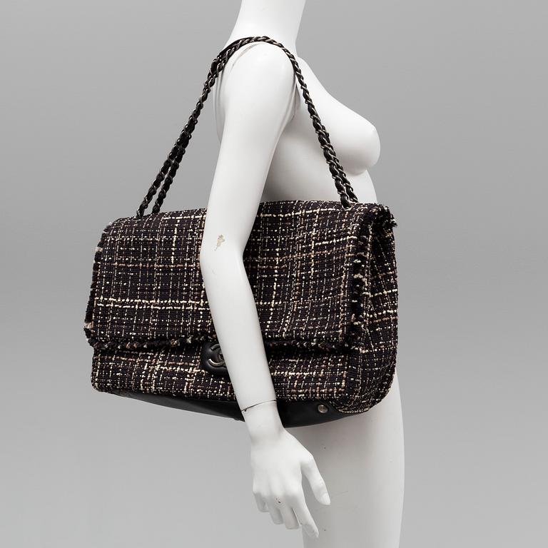 A tweed bag "Classic flip bag XL" by Chanel from 2016-2017.