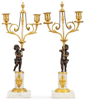 1020. A pair of late Gustavian two-light candelabra.