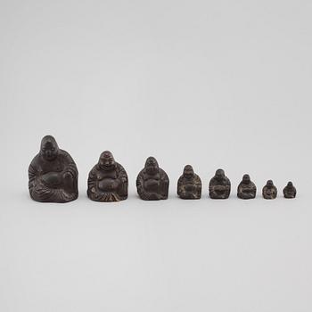 Eight Southeast Asian opium weights, 20th century.