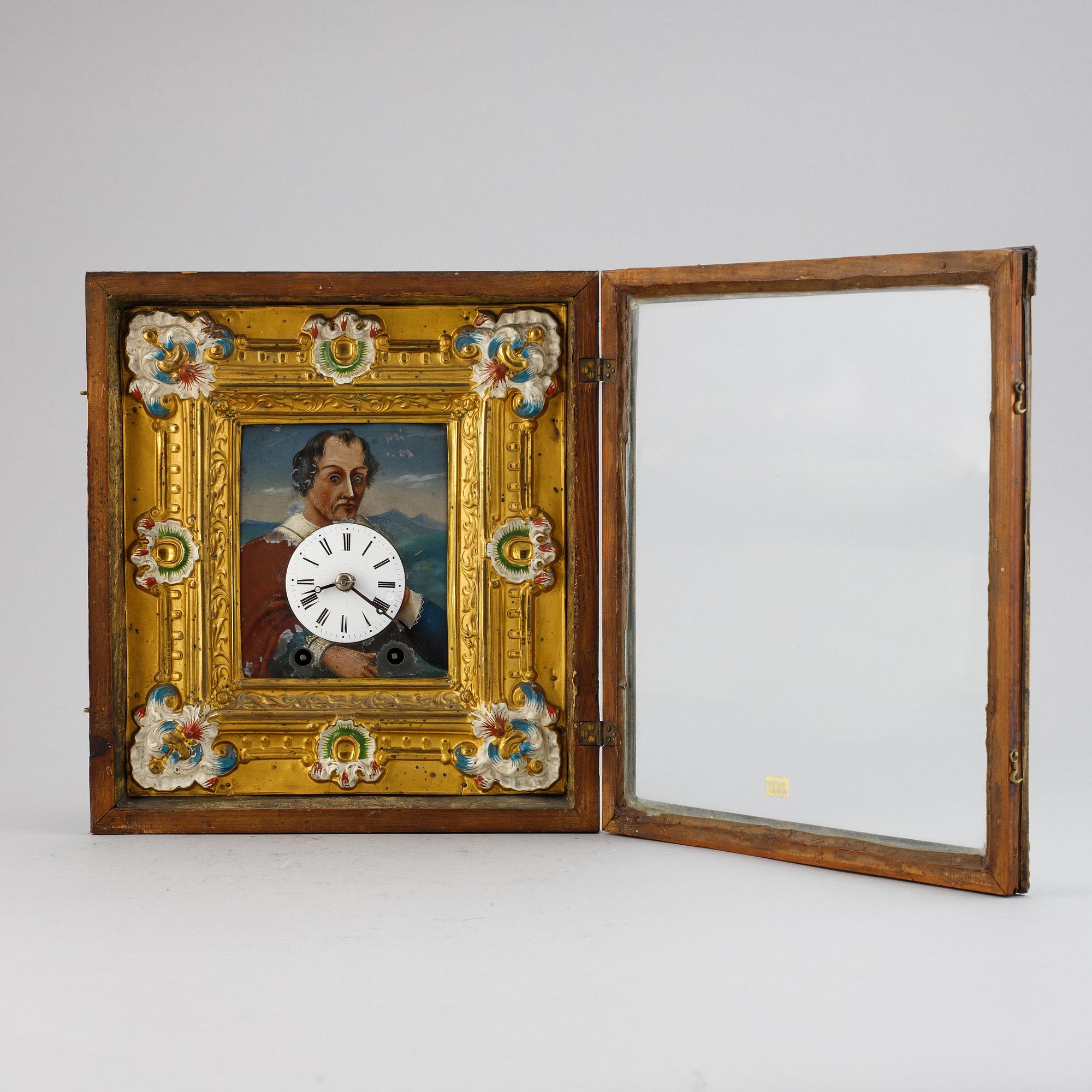 A Schwarzwald area wall pendulum clock with mechanical eye-movment, mid 19thcentury.