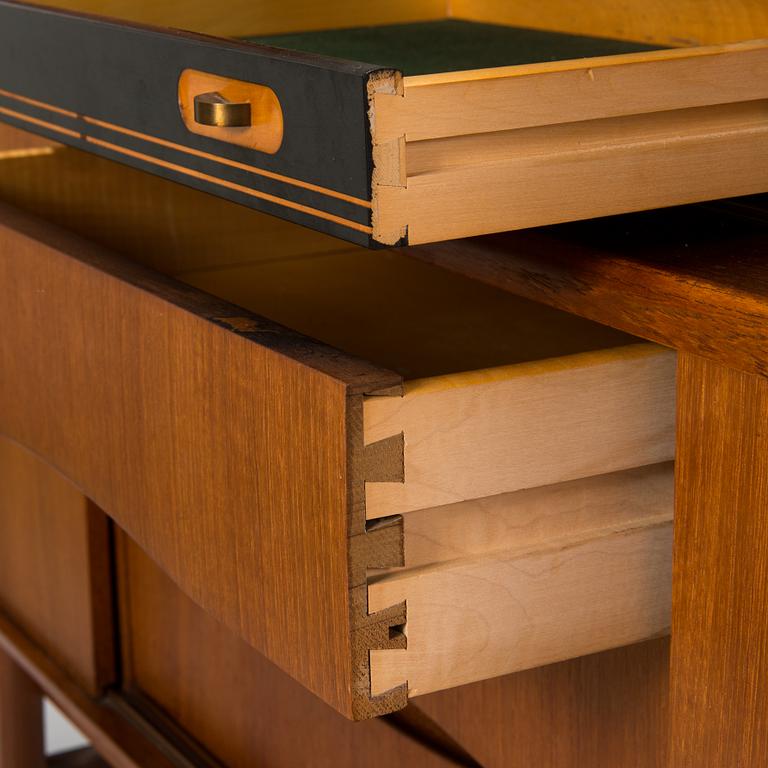 A Danish 1950s-60s cabinet with bar compartment.