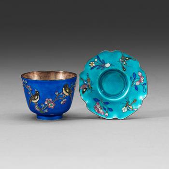 A set of 12 Chinese silver and enamel cups with saucers, decorated with birds and butterflies, China,early 20th Century.