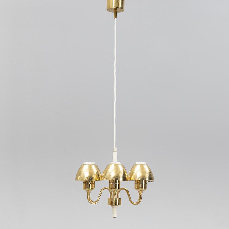 Hans-Agne Jakobsson, a 'T526' brass and wood ceiling light from Markaryd.