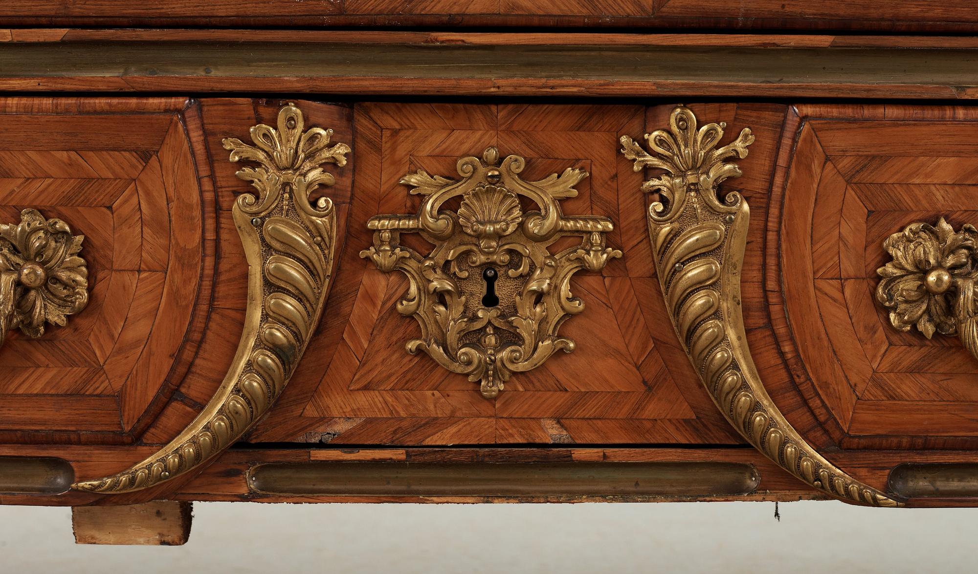 A French Régence 18th century commode in the manner of F. Mondon.