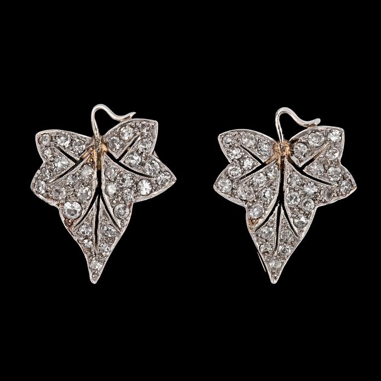 A pair of diamond brooch pins, early 20th century.