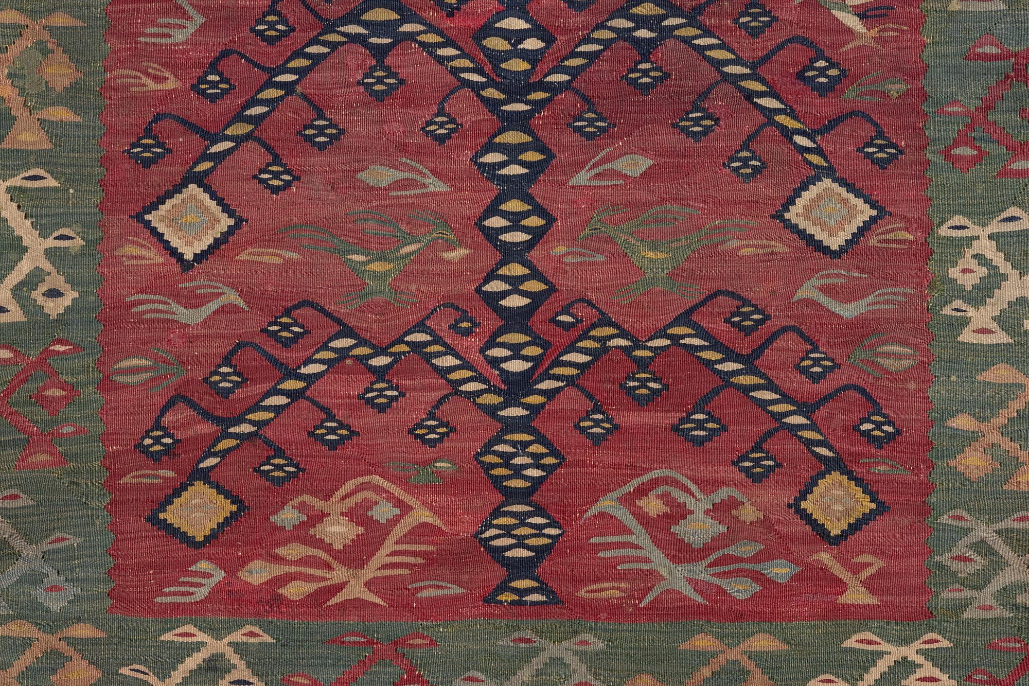 An antique Sarköy kelim, ca 239 x 214 cm.