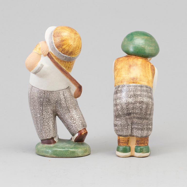 LISA LARSON, a pair of golfer stoneware figurines from Gustavsberg.