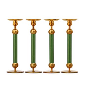 393. A set of four Svenskt Tenn brass and green lacquered candlesticks.