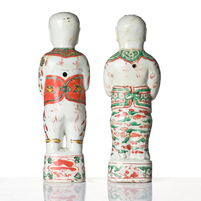 Three Chinese famille verte figures of laughing boys 'Hehe Erxian', 18th century.