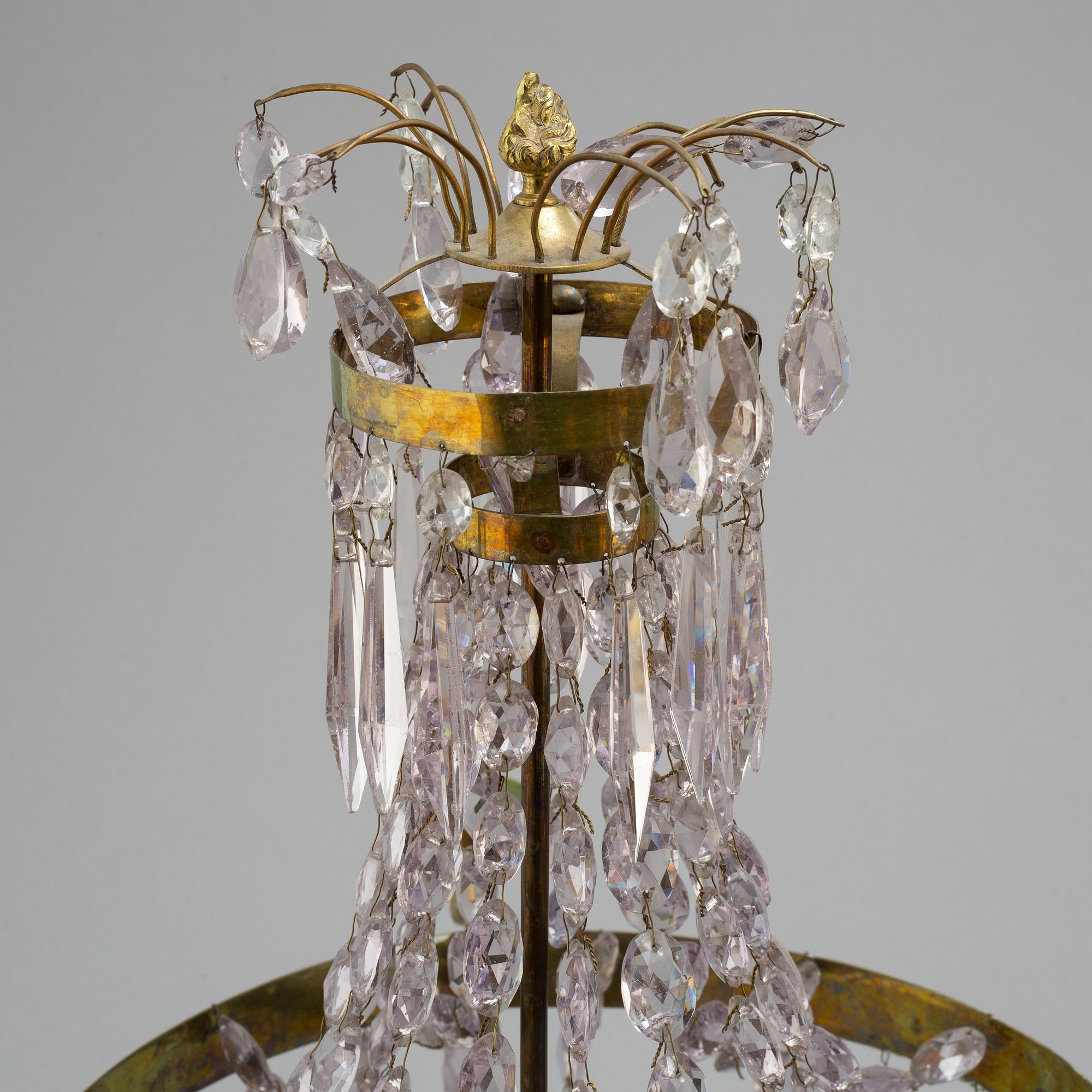 A pair of late Gustavian style three-light candelabra.