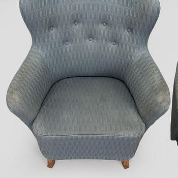 A pair of mid-20th century armchairs.