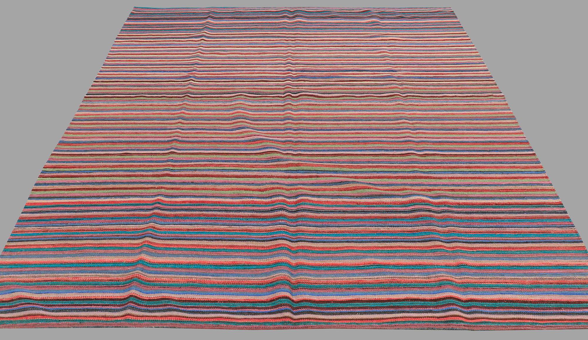 A CARPET, flat weave, around 269 x 207 cm.