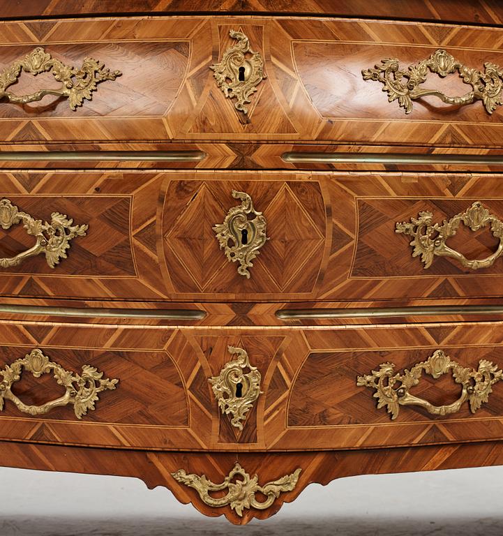 A rococo  gilt-brass mounted and rosewood parquetry commode by J. H. Reimers (master in Stockholm 1754-73).