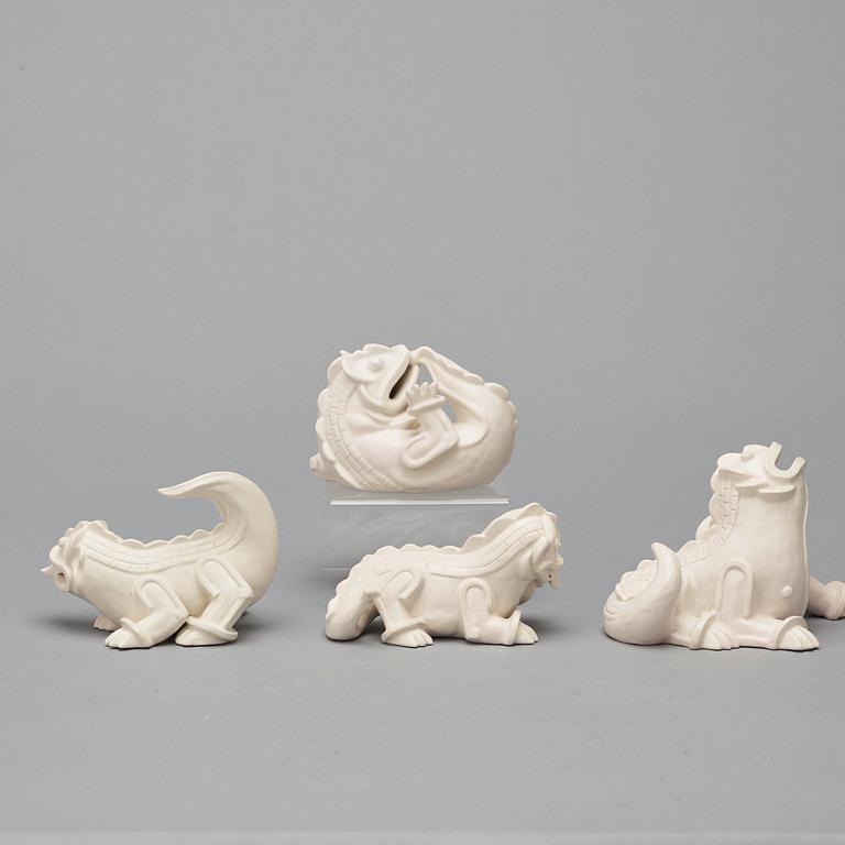 Wilhelm Kåge, a set of 4 stoneware figures of 'dragon puppies' Gustavsberg, Sweden 1940's.