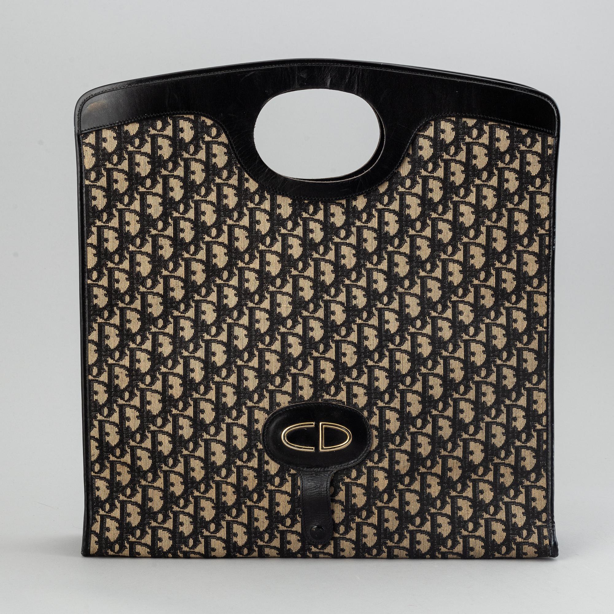 Christian Dior, Oblique fold-over convertible clutch.