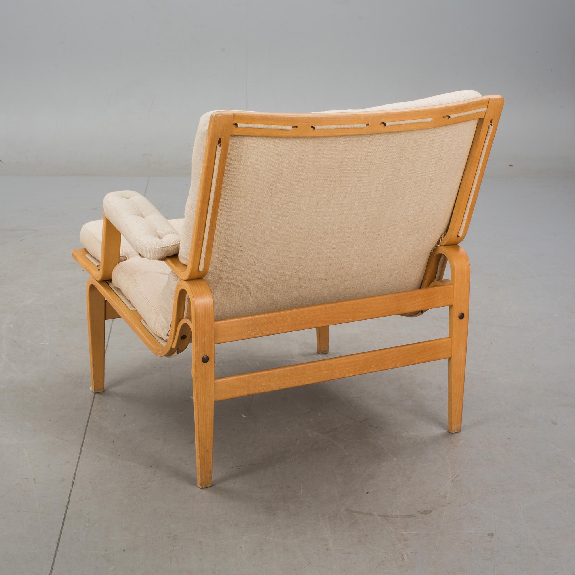 FÅTÖLJ. "Ingrid", Bruno Mathsson för DUX, 1900-talets andra hälft.