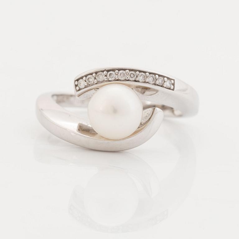 Brilliant cut diamond and cultured pearl ring.