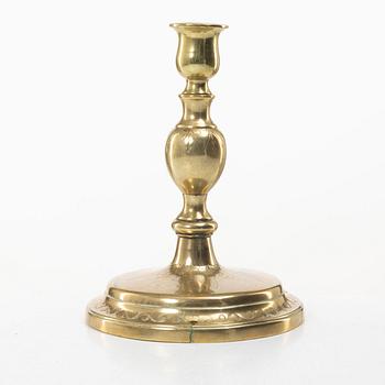A candle holder in brass, Baroque, 17th/18th century.