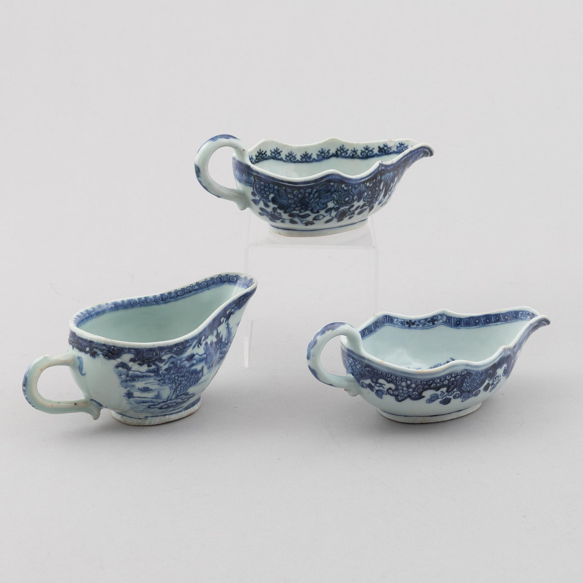 A group of three Chinese blue and white sauce boats, Qing dynsty, Qianlong (1736-95).