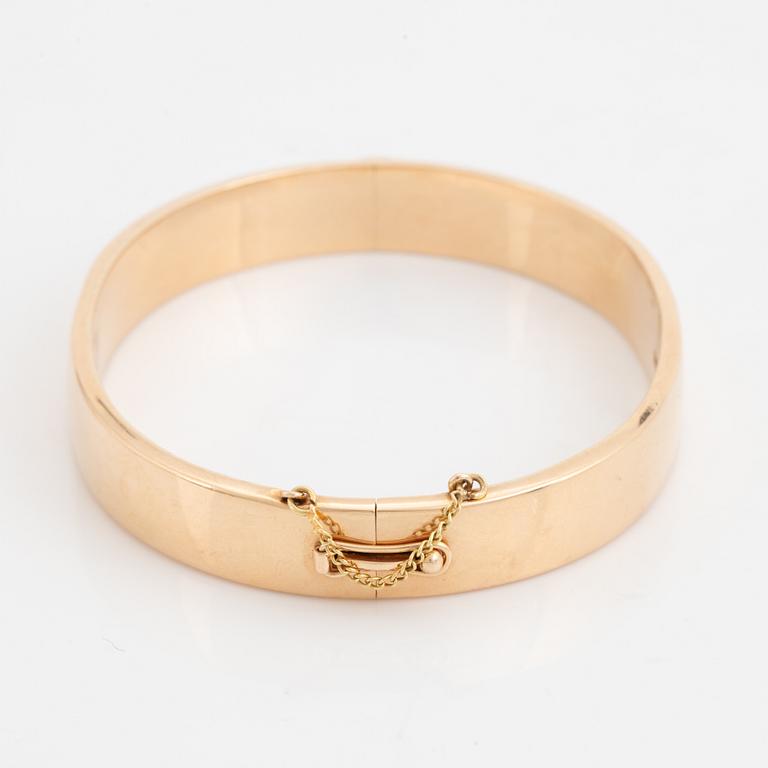 A 14K gold bracelet.