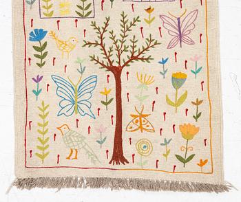 A hand-embroidered kilim runner, c. 300 x 80 cm.