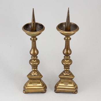 A pair of 17th century bronze candlesticks.