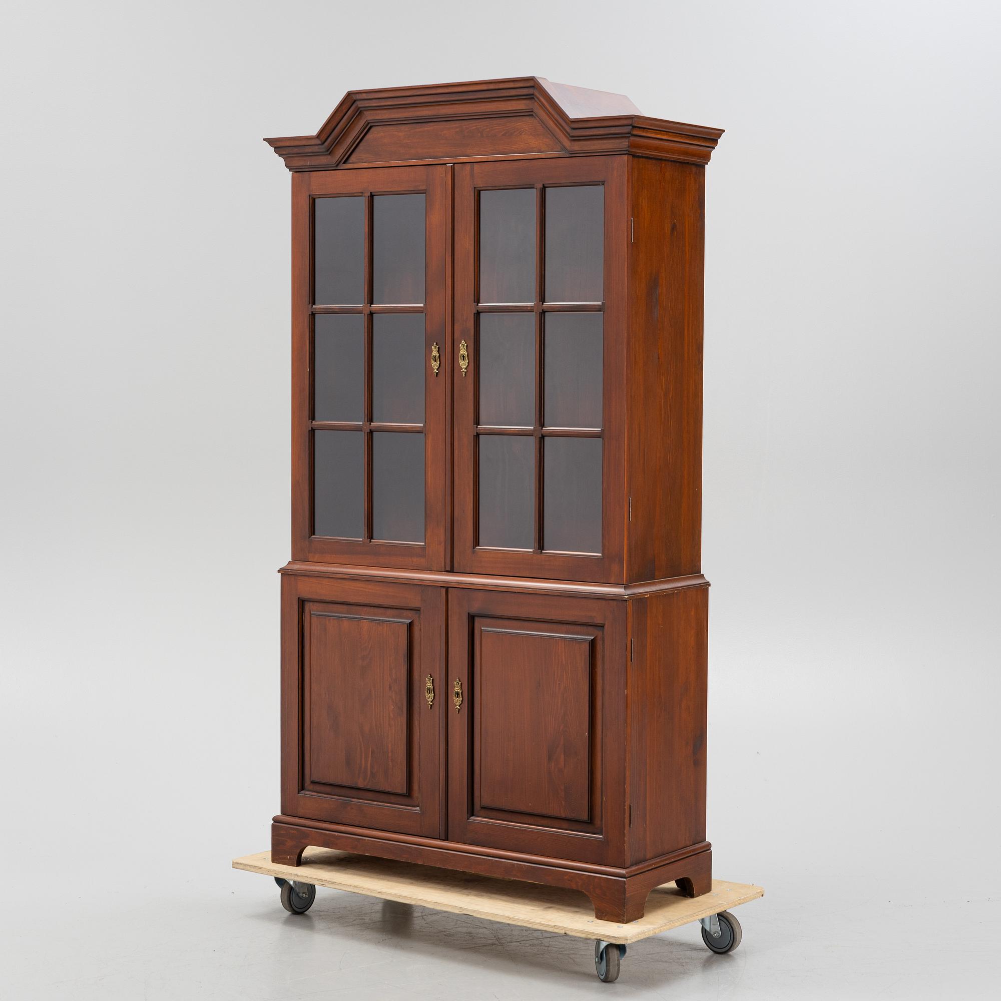 A vitrine cabinet from Åmells, dated 1975.