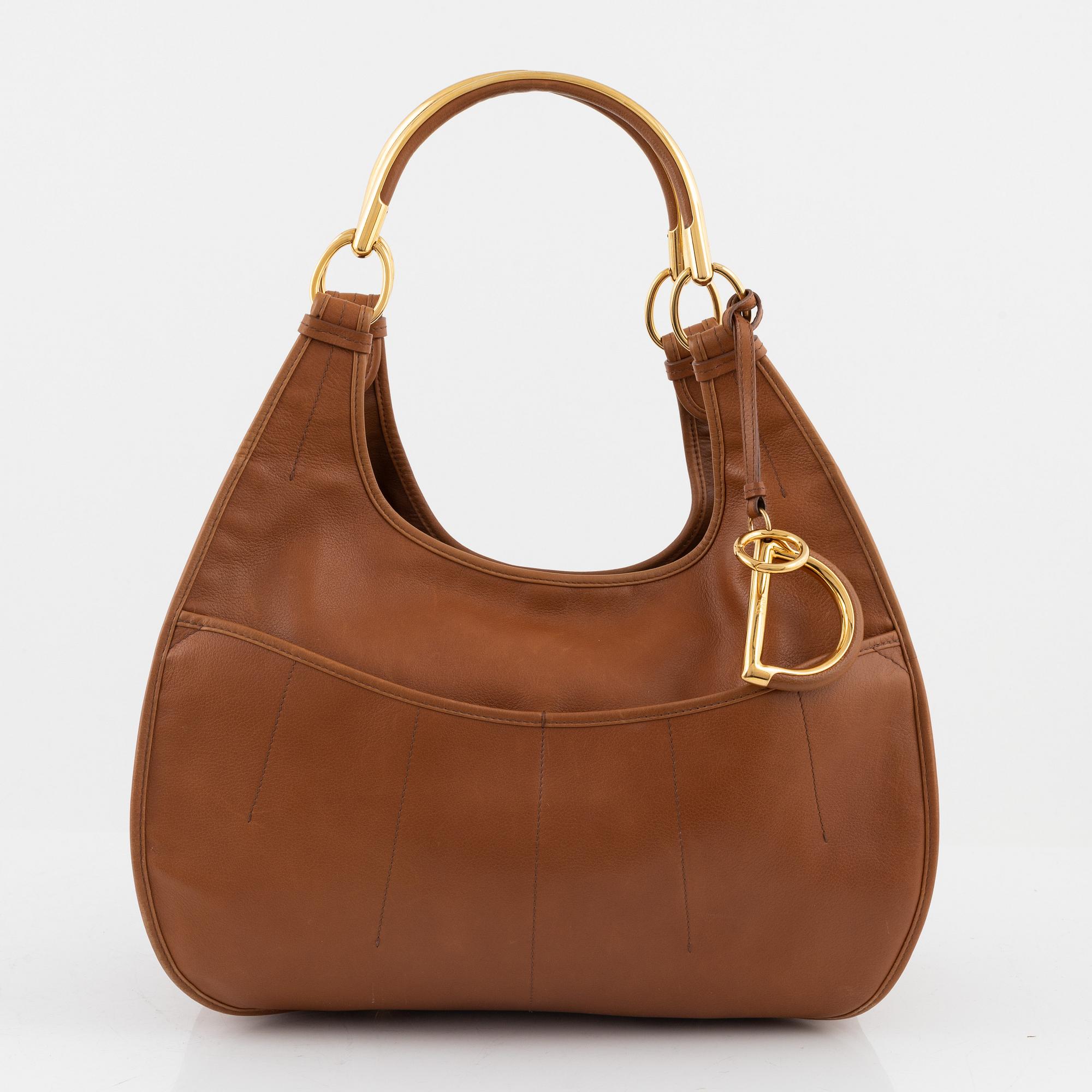 Christian Dior, a brown leather handbag.