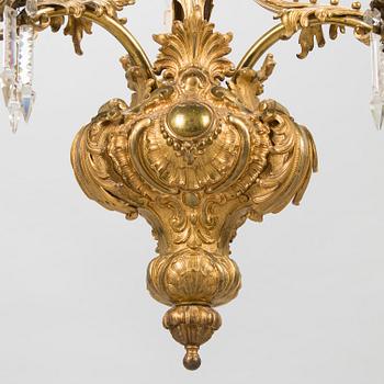 A brass chandelier with prisms, second half of the 19th century. Height 83 cm.