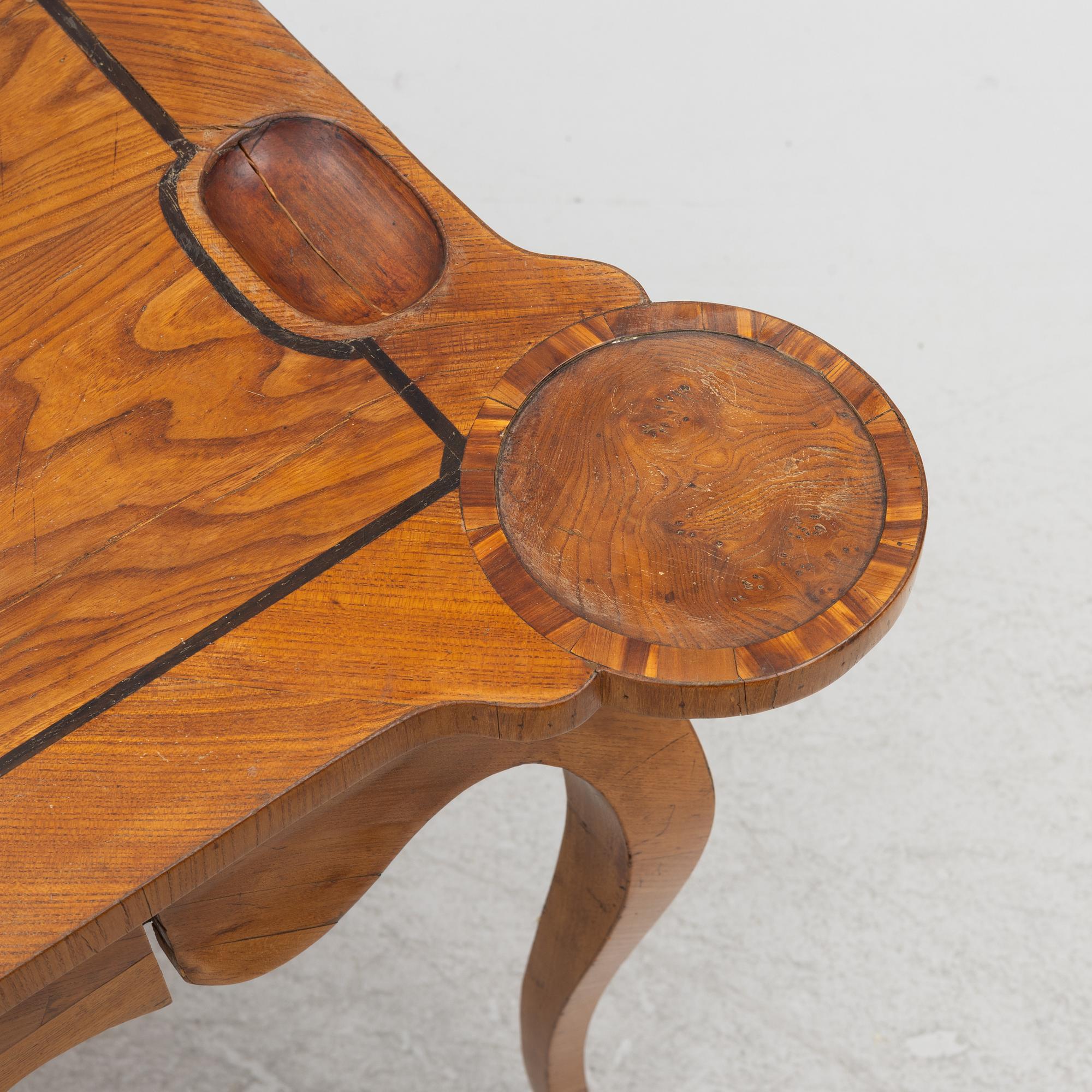 A rococo card table, mid 18th century.